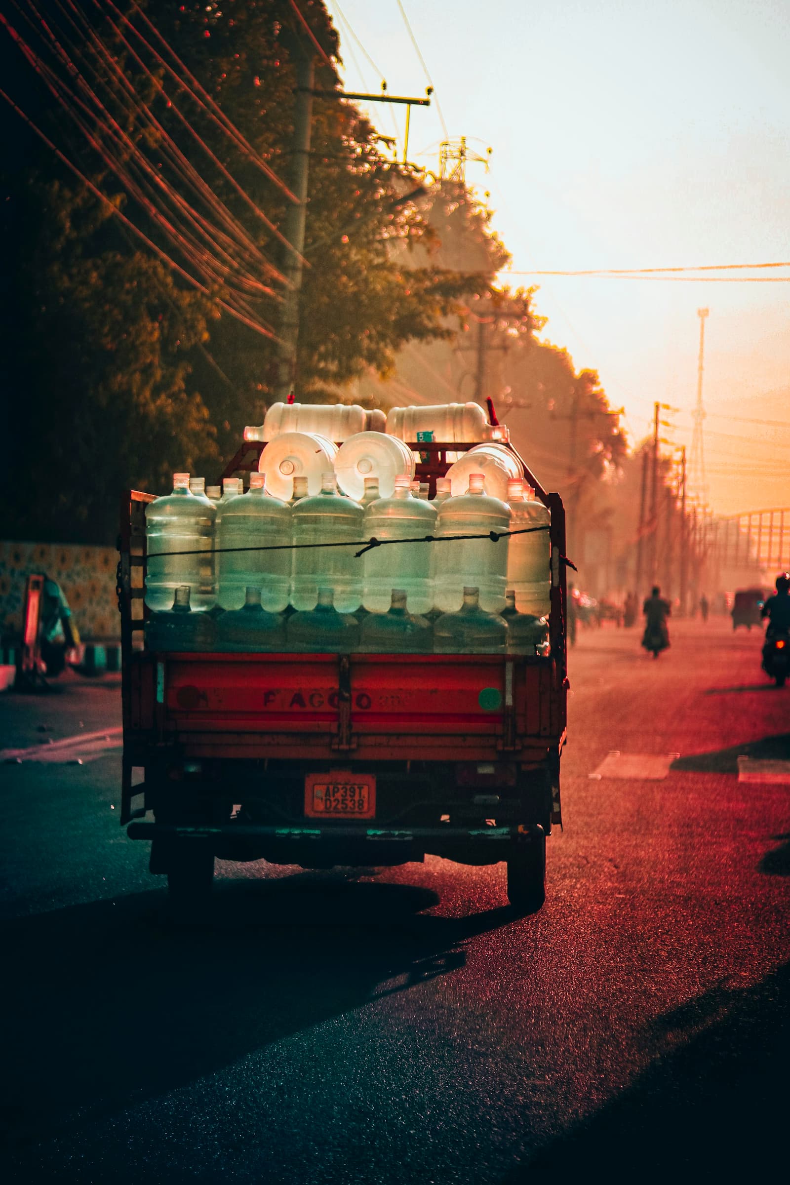 A CyanBay vehicle loaded with nineteen-litre jars at dusk