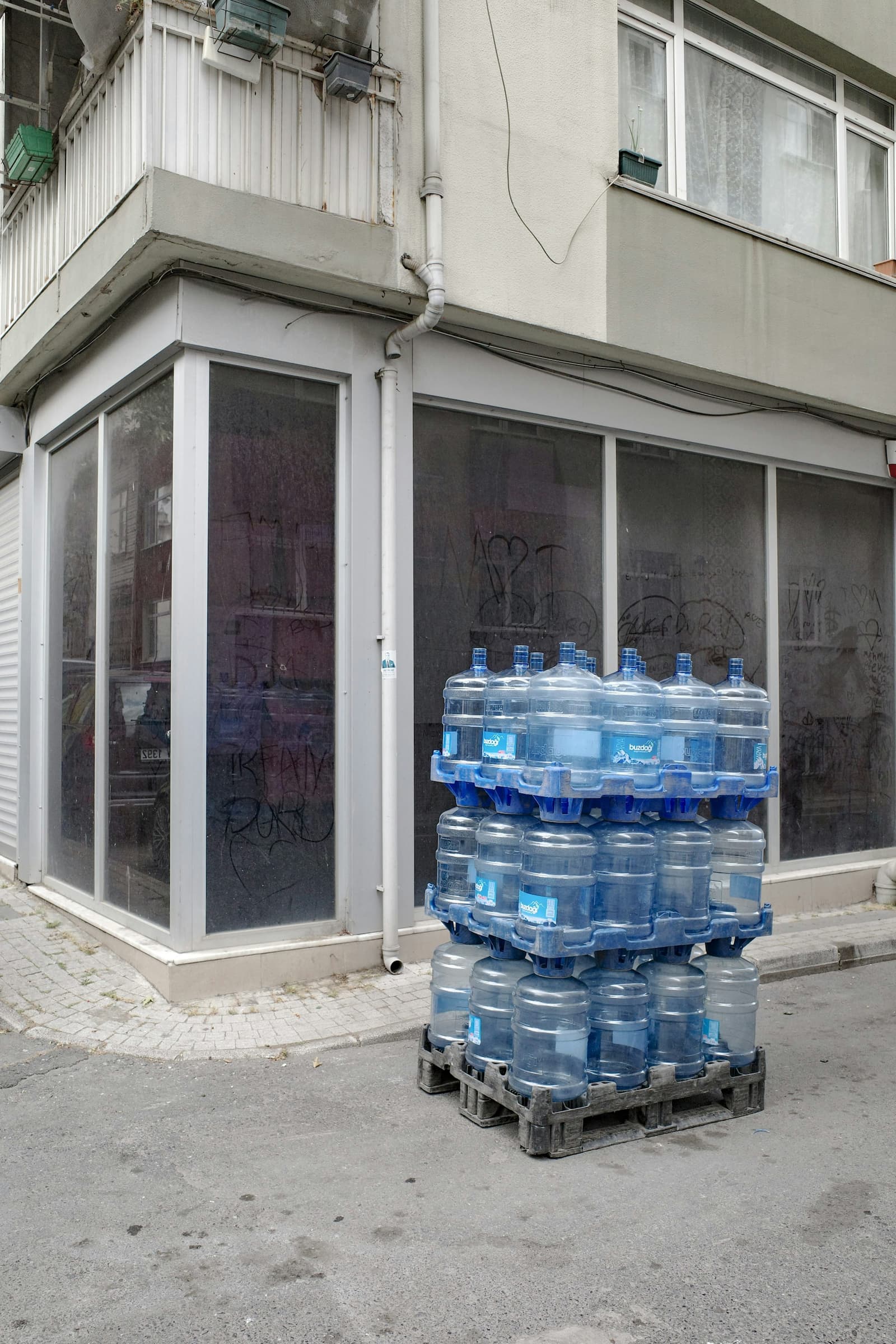Stacked nineteen-litre jars ready for the route