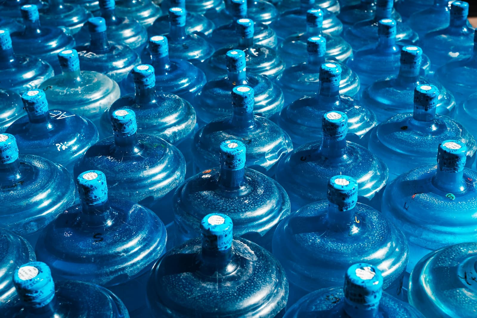 Sealed nineteen-litre CyanBay water jars ready for delivery
